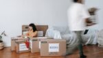 A man and woman packing for relocation.